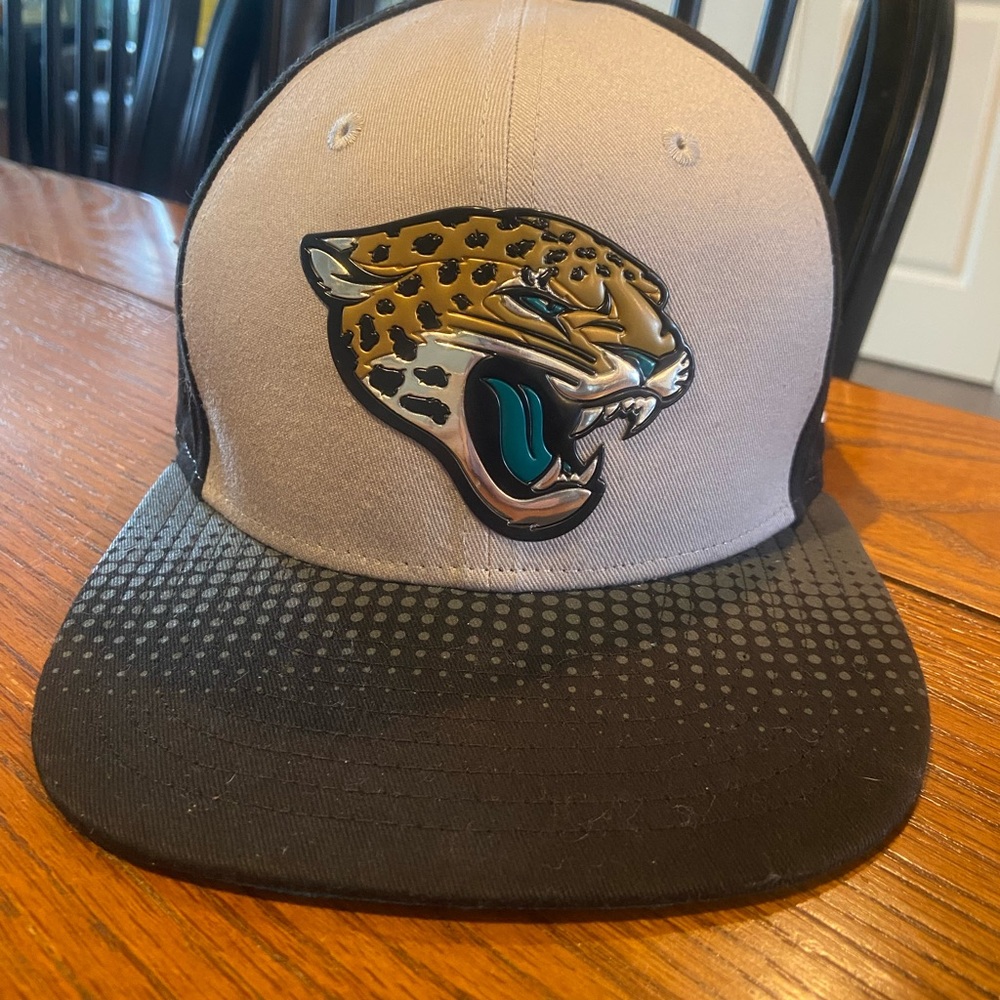Two Jacksonville Jaguars caps by 9Fifty brand.  Original fit OSFM.  New Era.